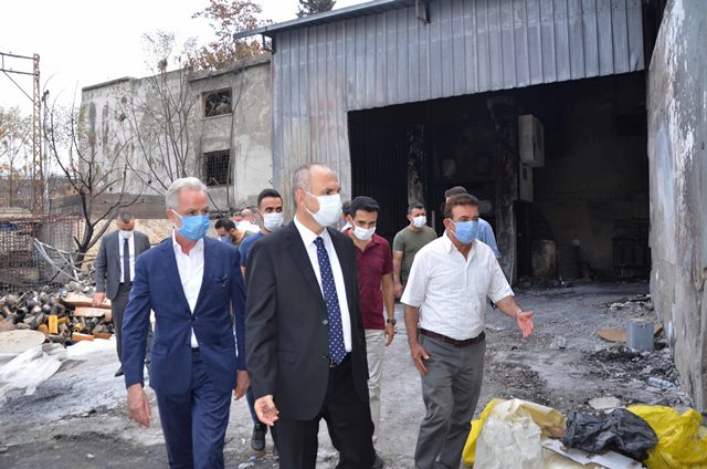 Orman yangınında iş yerleri hasar gören üyelerini ziyaret etti