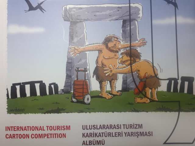 Defneli karikatürüstü tebrik etti